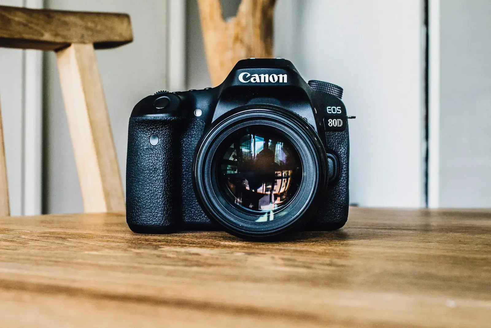 DSLR camera on a wooden desk